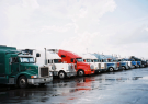 learn currency trading - a row of trucks